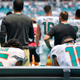 Albert Wilson #15 and Kenny Stills #10 of the Miami Dolphins sit during the National Anthem against the Tennessee Titans at Hard Rock Stadium on September 9, 2018 in Miami, Florida.